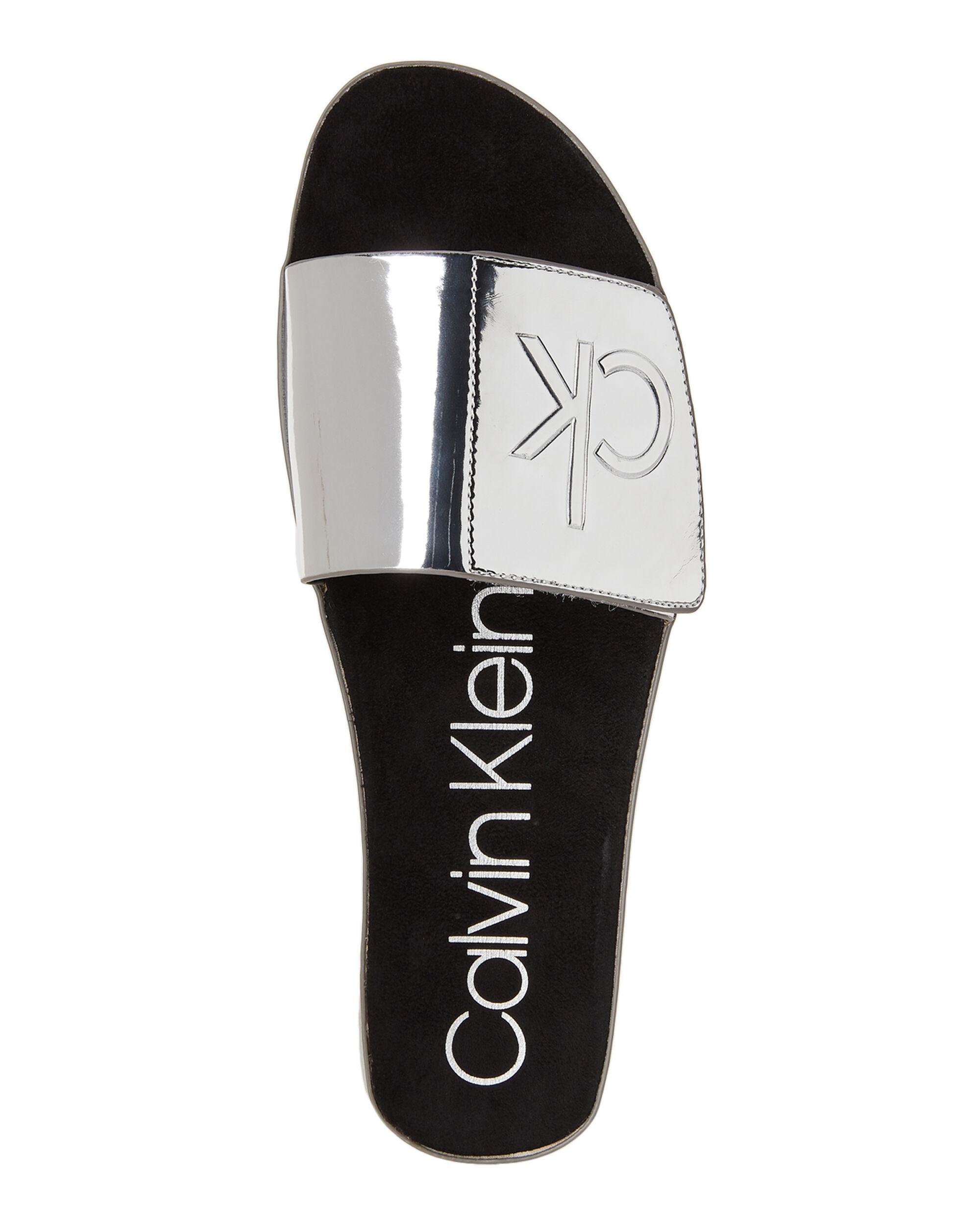 Calvin Klein Silver Marlina Metallic Slide Sandals - Lyst