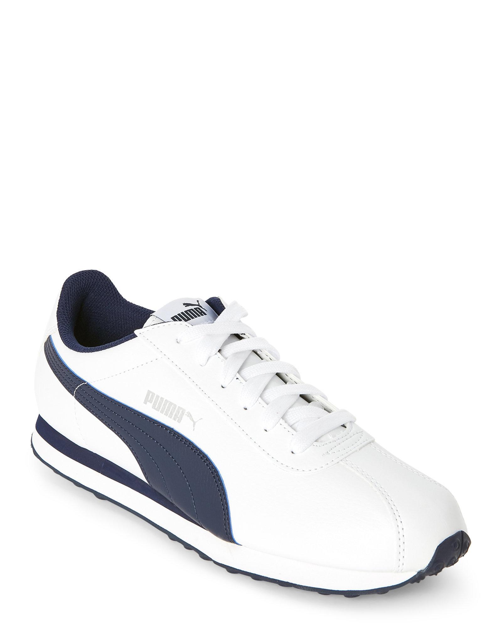 white and blue puma shoes