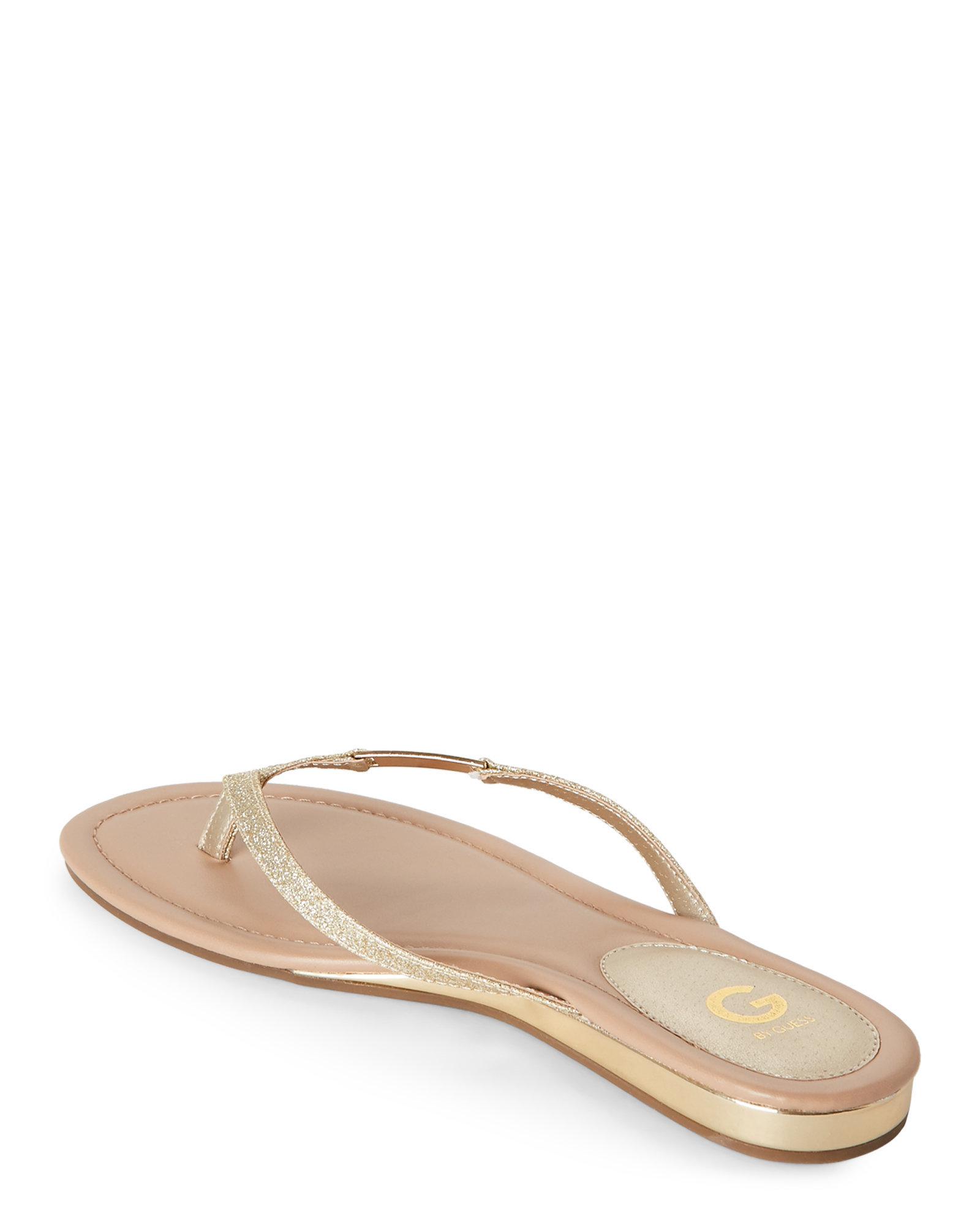 guess gold flip flops