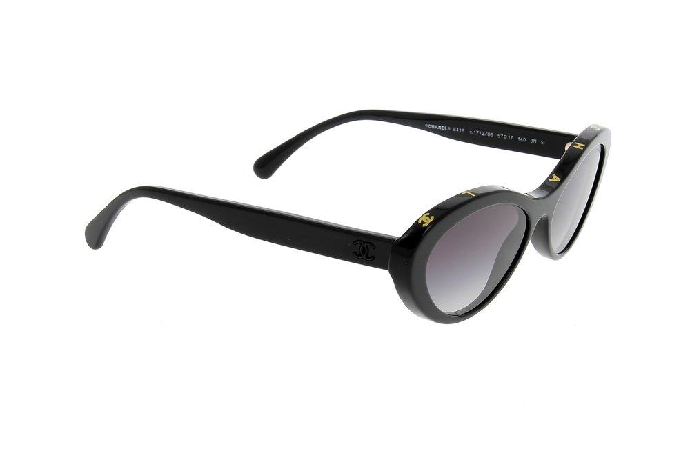 Chanel Oval Frame Sunglasses in Black | Lyst