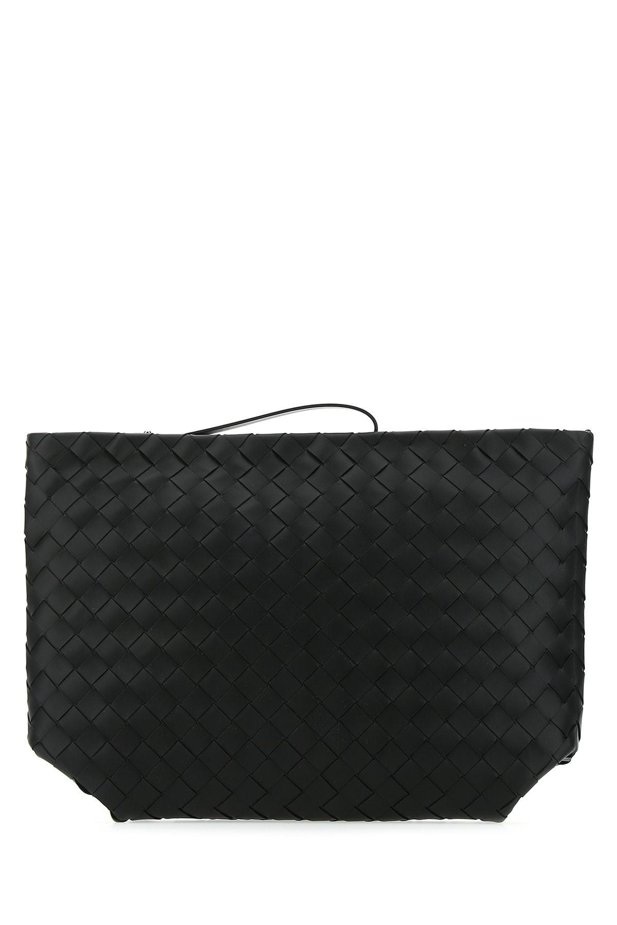 black woven clutch bag