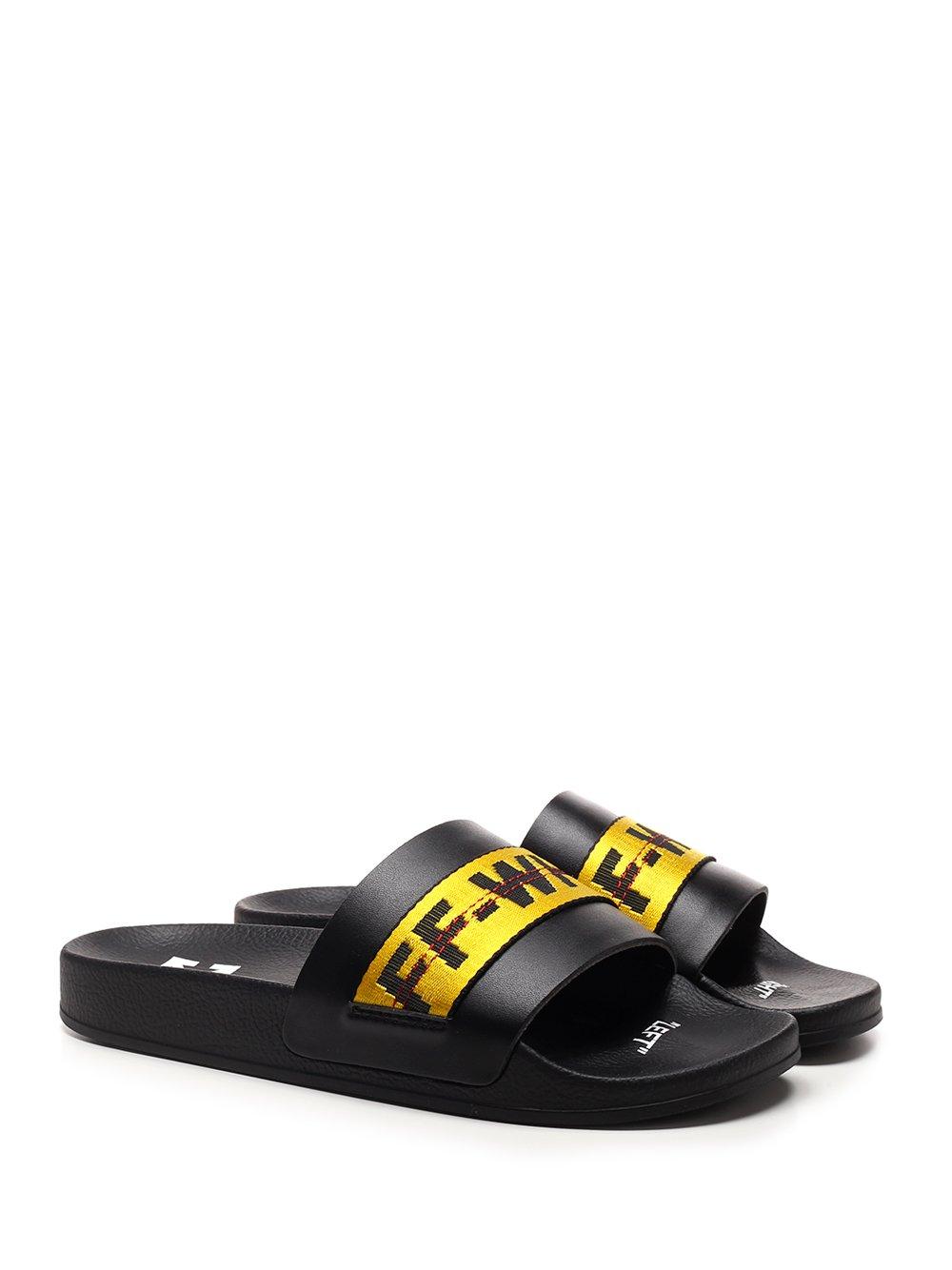 burgundy nike slides with gold nike sign
