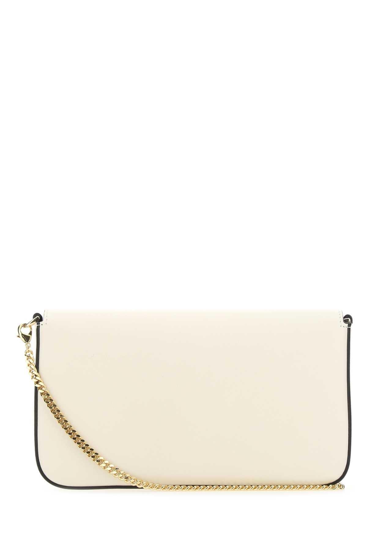 white purse with gold chain