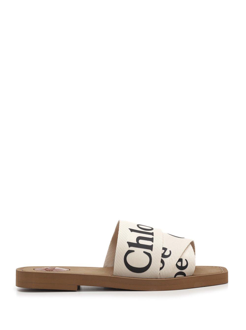 ChloÃ© Leather Woody Flat Logo Ribbon Slide Sandals in White - Save 26% - Lyst