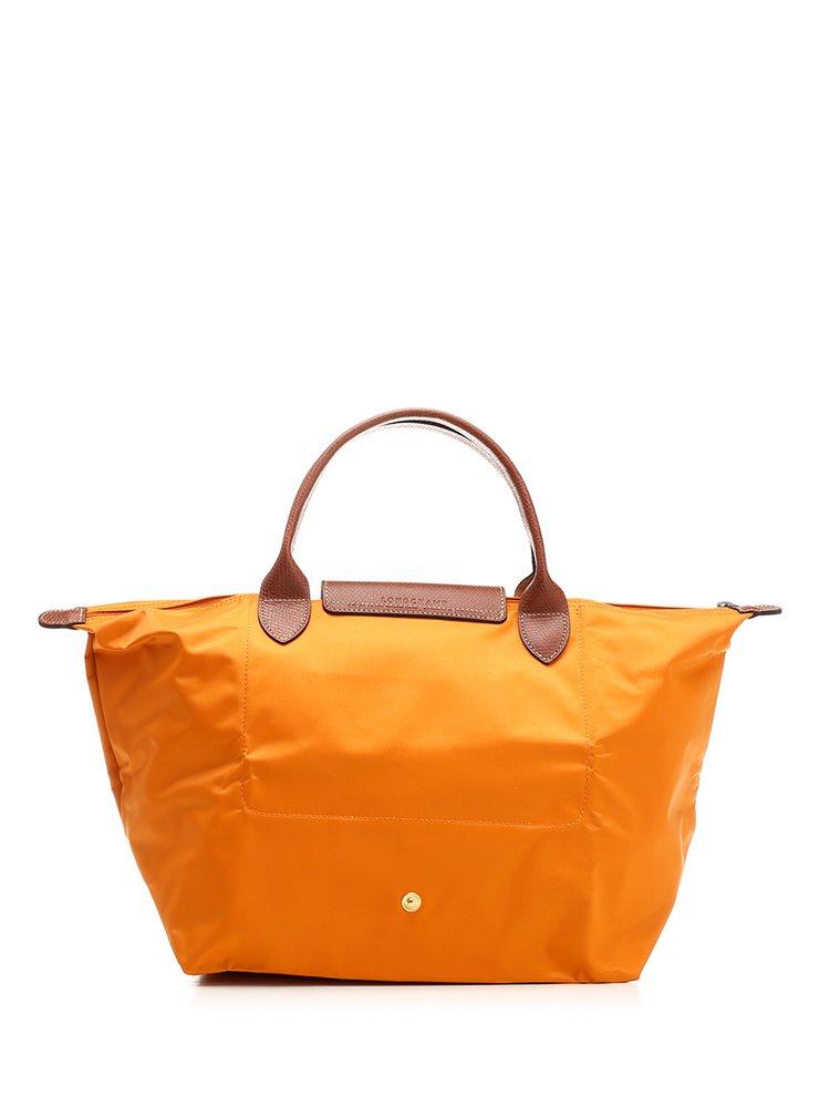 Longchamp Le Pliage Medium Top Handle Bag in Orange | Lyst
