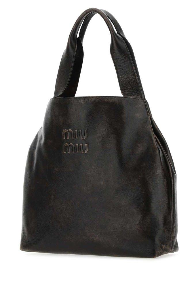 Miu Miu Distressed Effect Logo Embossed Shoulder Bag in Black | Lyst