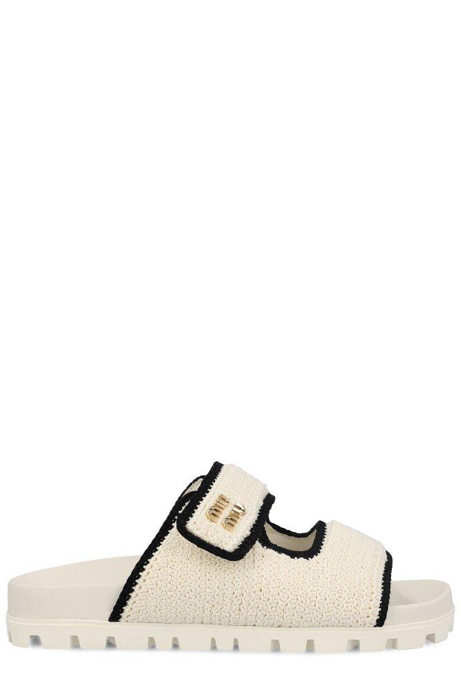 【送料&関税込】Miu Miu Slip-on Sandals Miu Miu Logo-Lettering Slip-On Sandals in Natural | Lyst