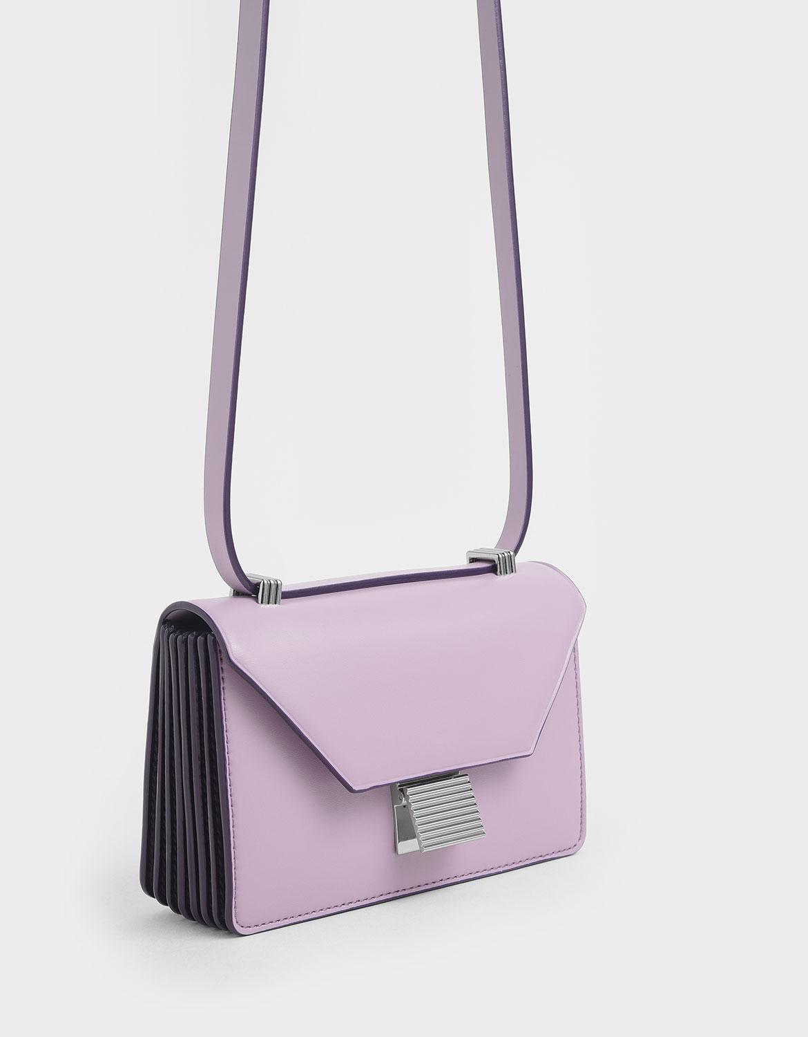 metallic push lock crossbody bolsa charles and keith
