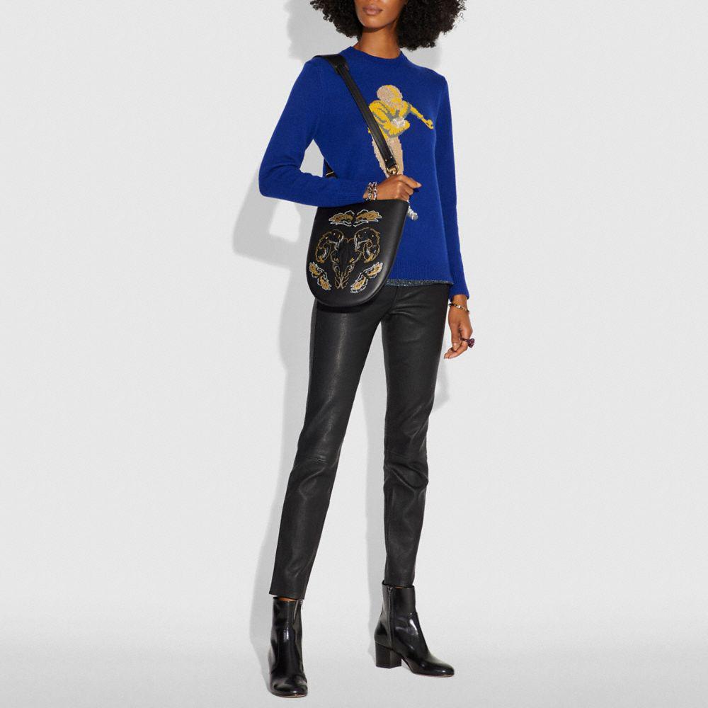 coach sling bag with tattoo