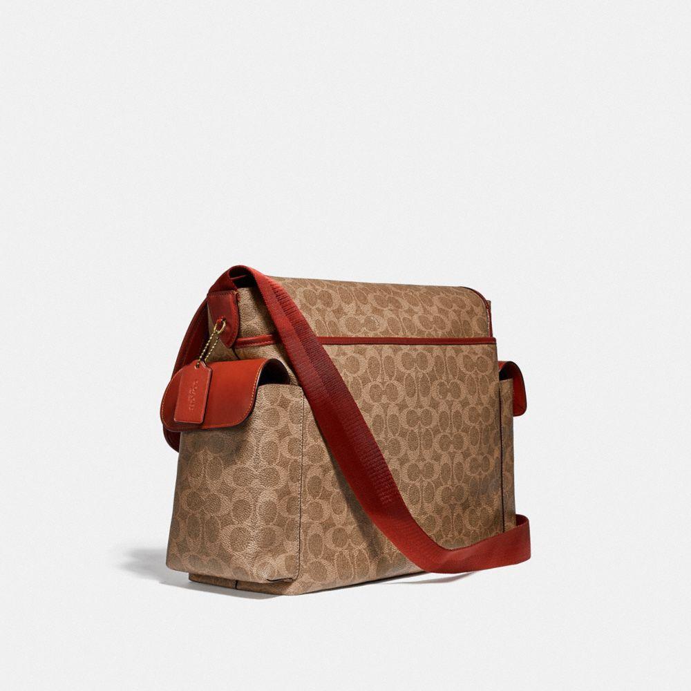 COACH Baby Messenger Bag In Signature Canvas in Brass/Tan Rust (Brown