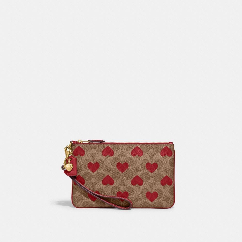 COACH Small Wristlet In Signature Canvas With Heart Print in Brown Lyst