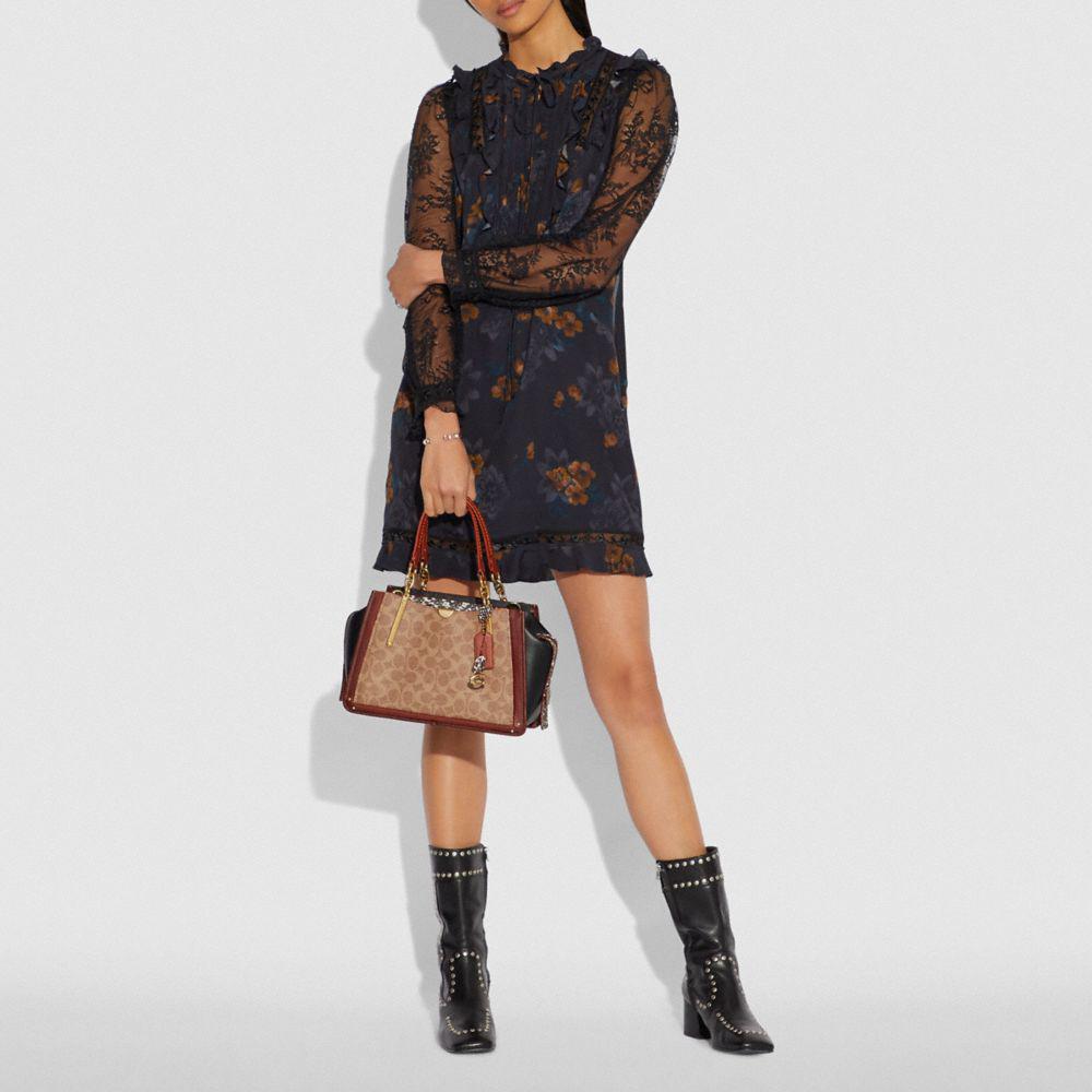 dreamer in signature canvas with snakeskin detail