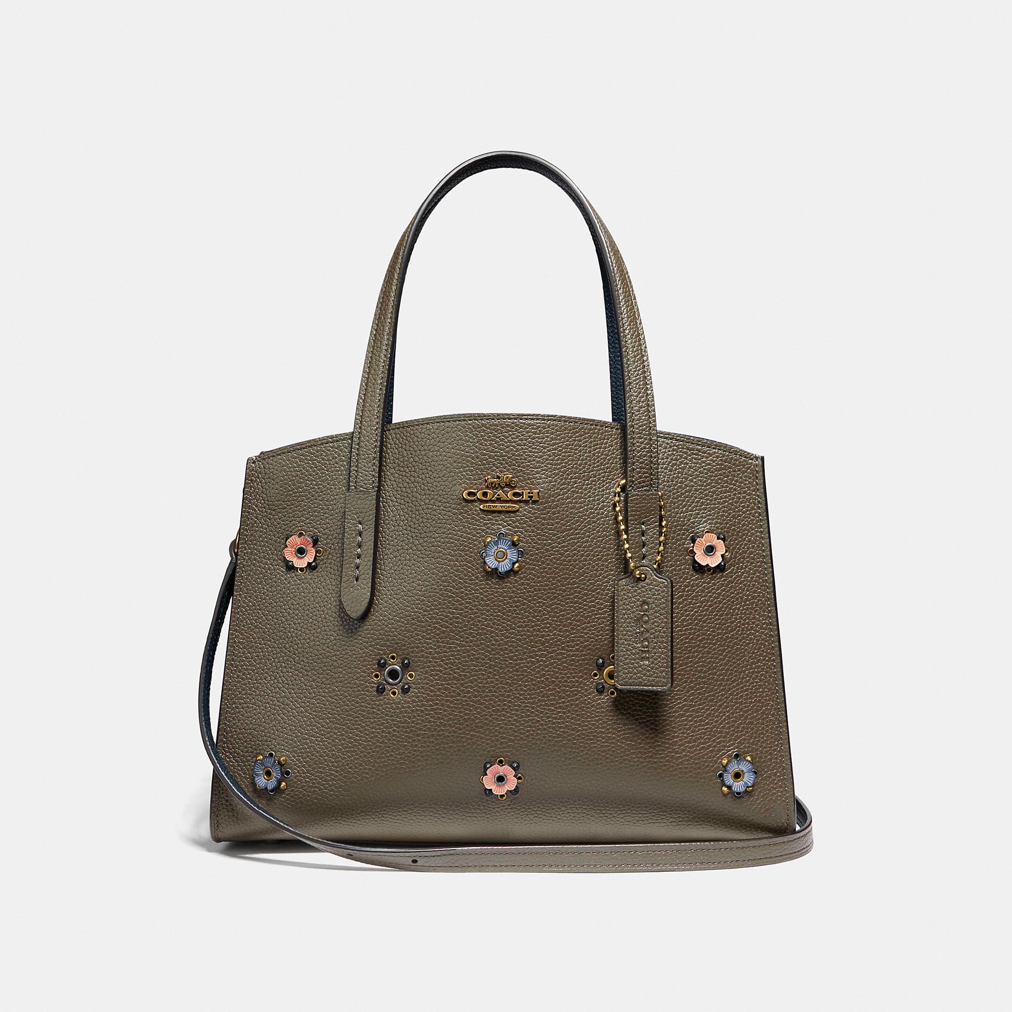coach charlie carryall with rivets