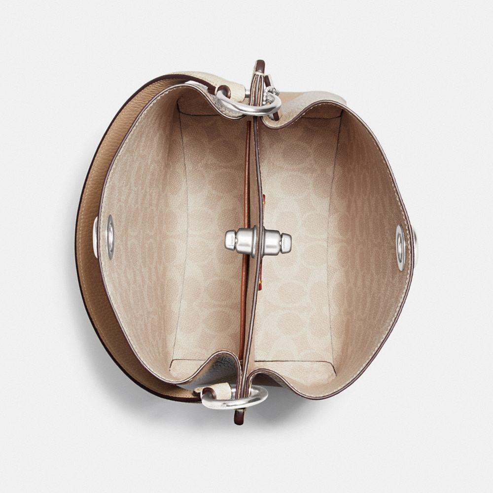 charlie bucket bolsa 21 in blocked signature canvas