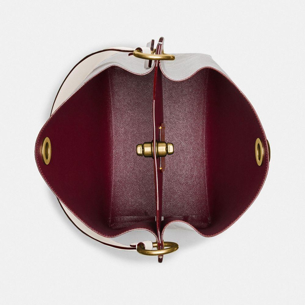 charlie bucket bolsa 21 in blocked signature canvas