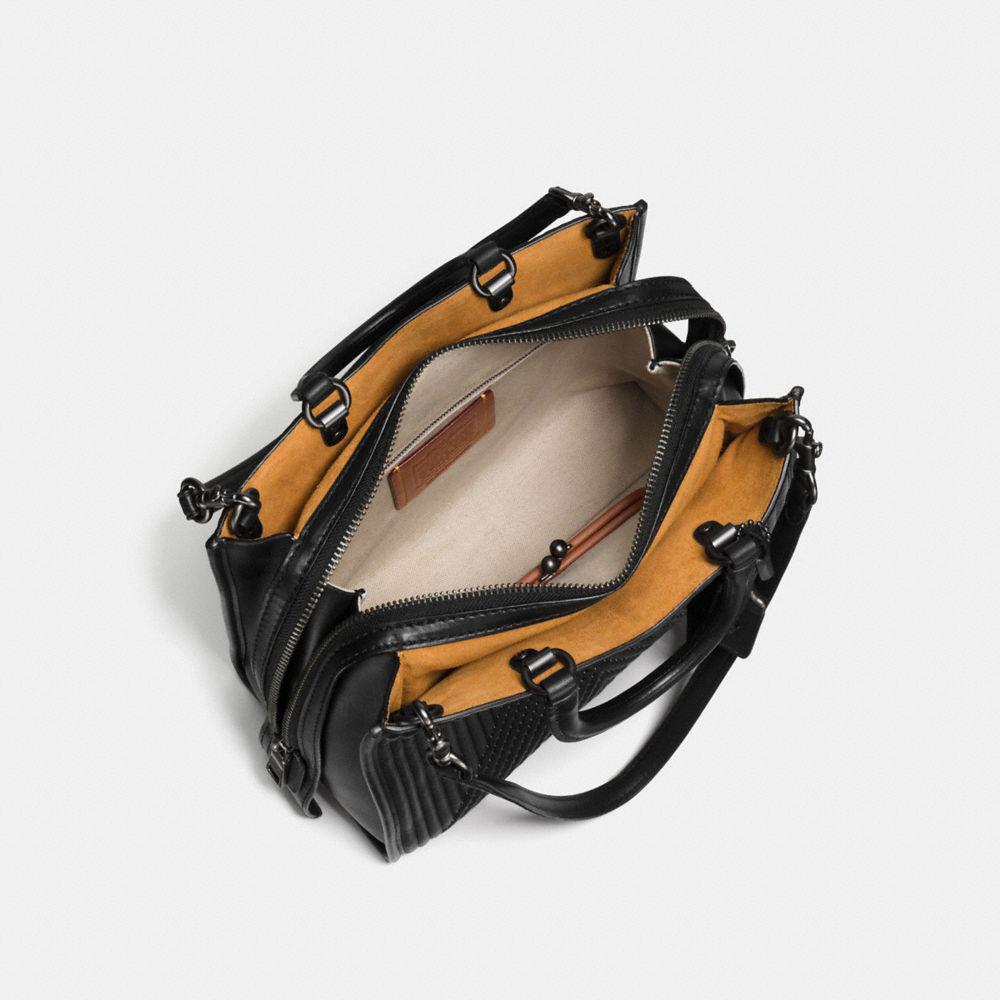 coach rogue with rivets