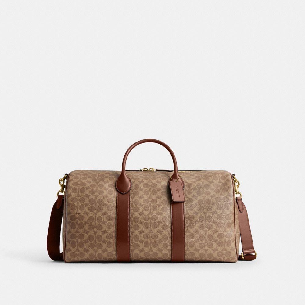 coach travel men duffel bag Soccer Duffle Brown / Ivory Crafted of Signature canvas and smooth leather this duffle bag includes inside snap cell phone and multifunction pockets for easy organization and it comfortable fits a tablet COACH Men's Gotham 45 in