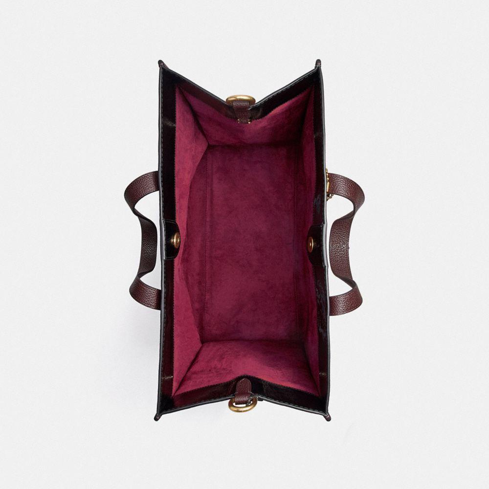 coach field tote 40 with horse and carriage print and varsity stripe