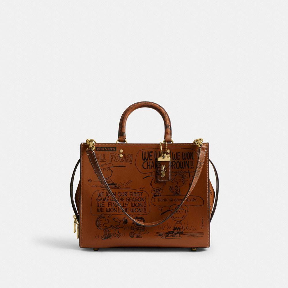 COACH X PEANUTSローグ バッグ・ニュースペーパー プリントブラウン COACH X Peanuts Rogue Bag With Newspaper Print in Brown | Lyst