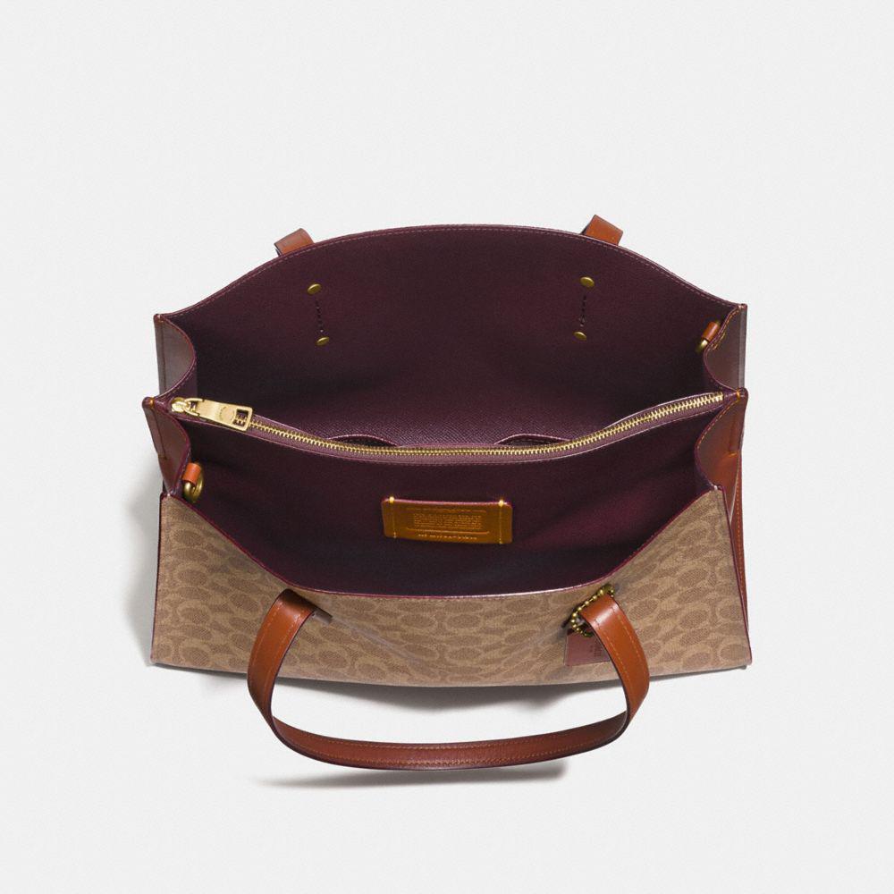 coach charlie signature canvas carryall tote