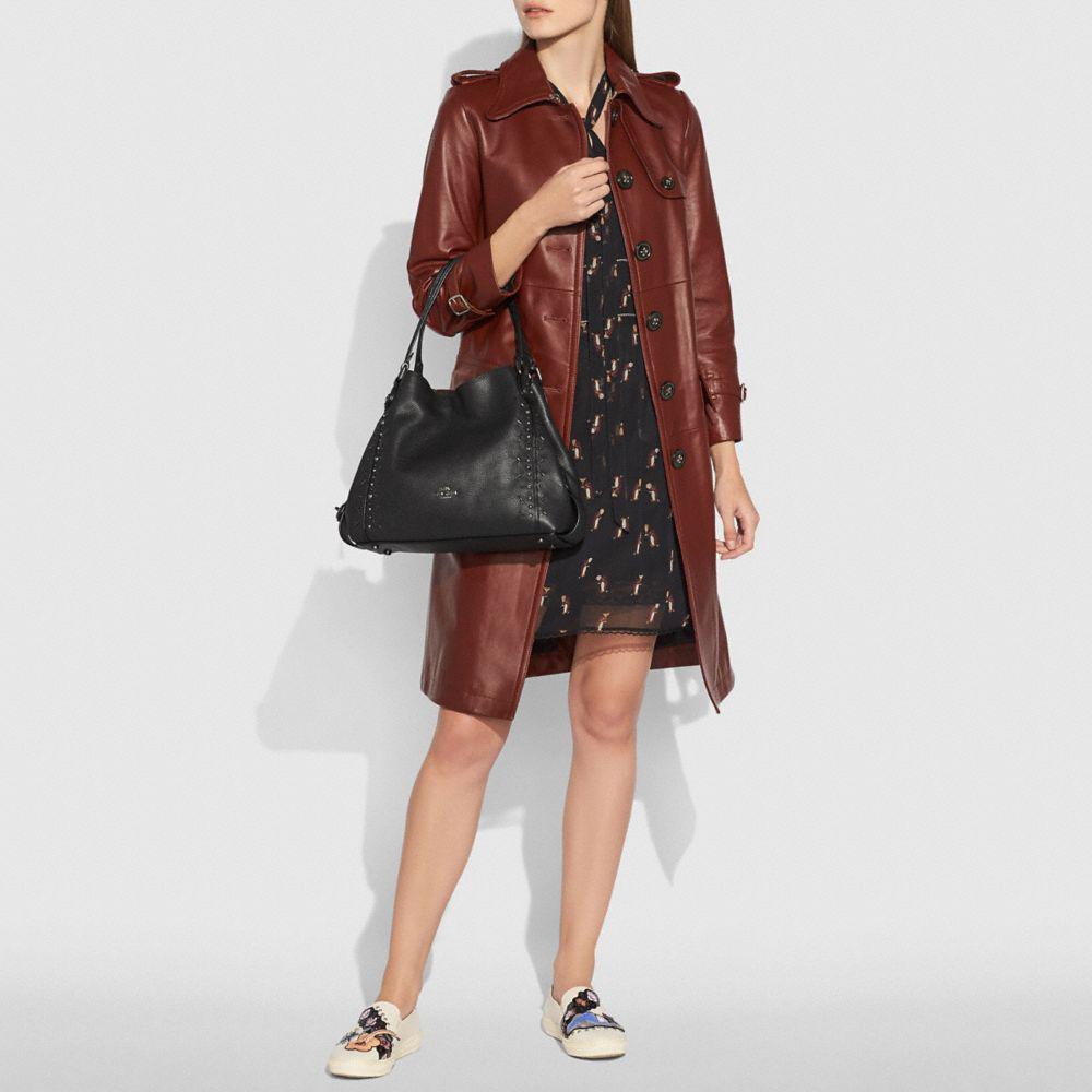 edie shoulder bag 31 in signature canvas with rivets
