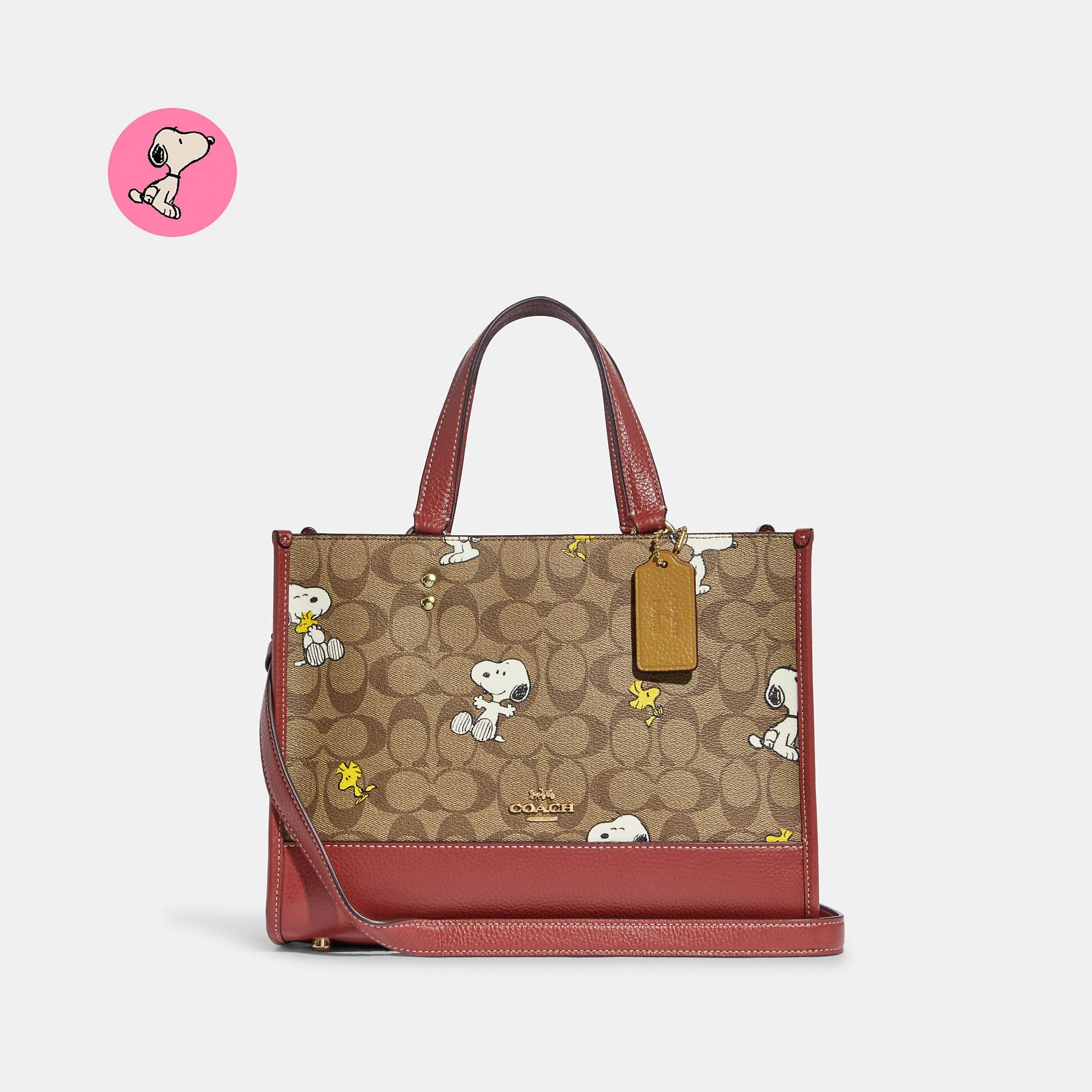 Coach Outlet Coach X Peanuts Dempsey Carryall In Signature Canvas With Snoopy Woodstock Print in