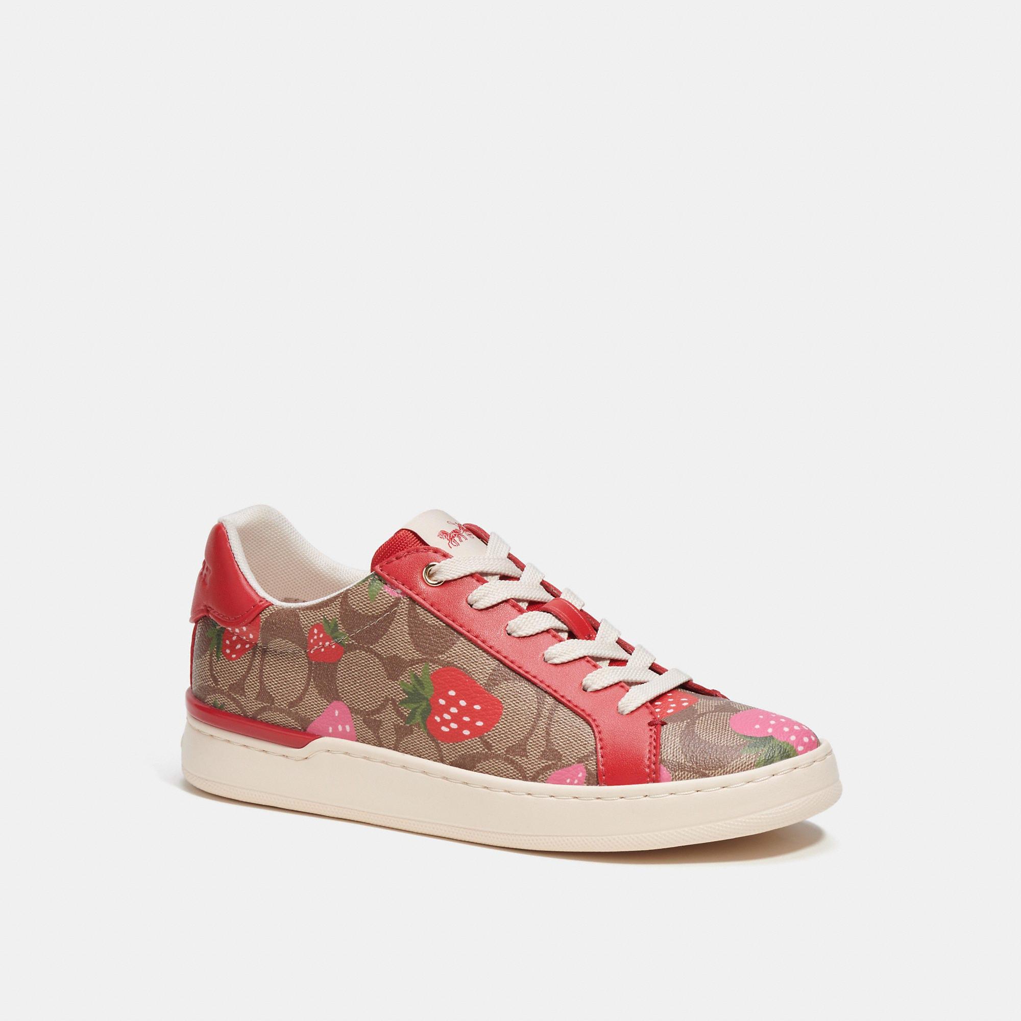 https://cdna.lystit.com/photos/coachoutlet/92895469/coach-outlet-Red-Clip-Low-Top-Sneaker-In-Signature-Canvas-With-Wild-Strawberry-Print.jpeg