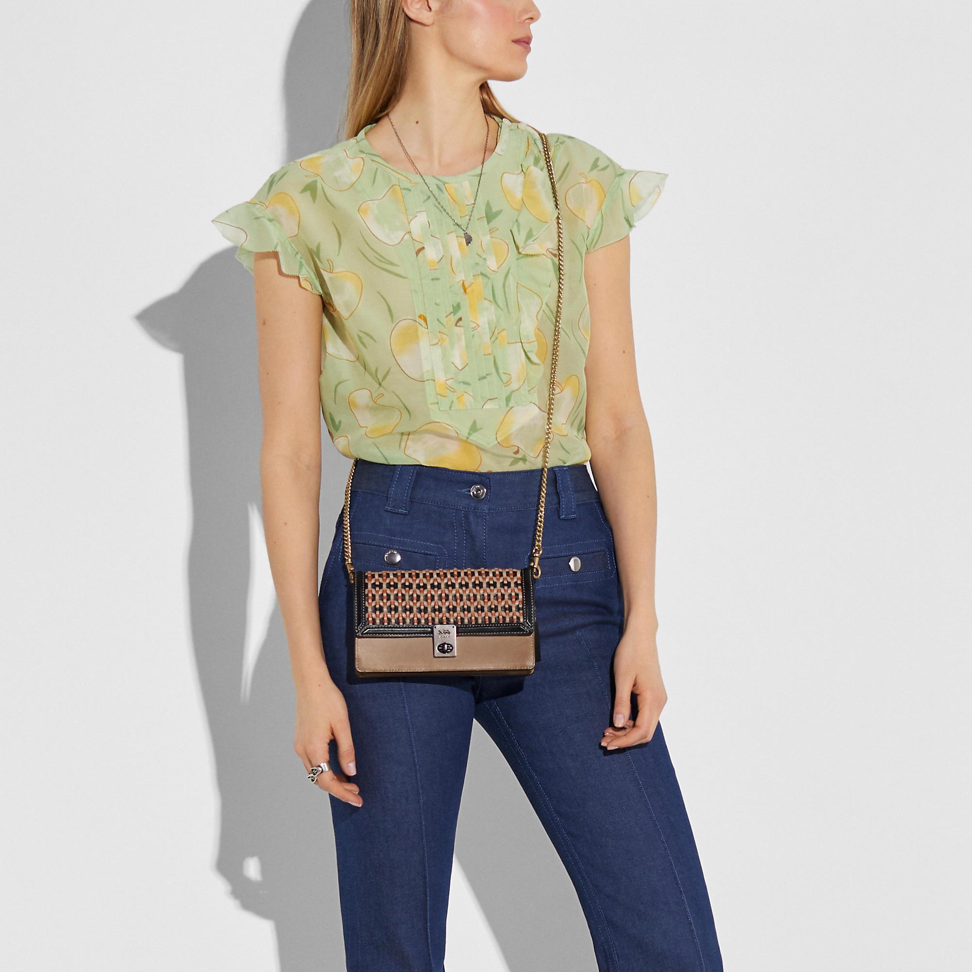 Coach hutton clutch new arrivals