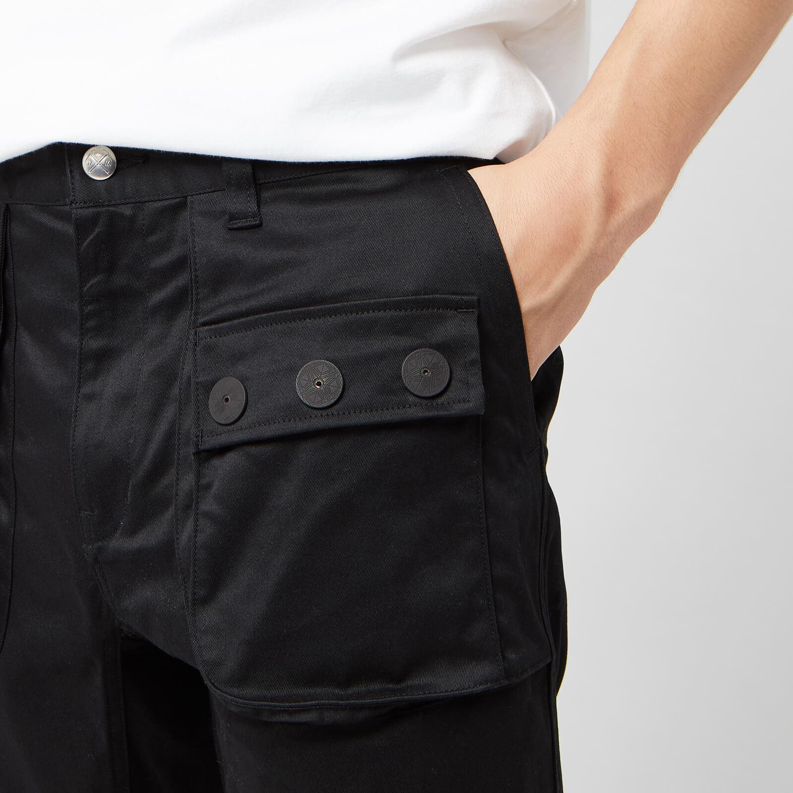White Mountaineering Stretched Double Pockets Tapered Pants in 
