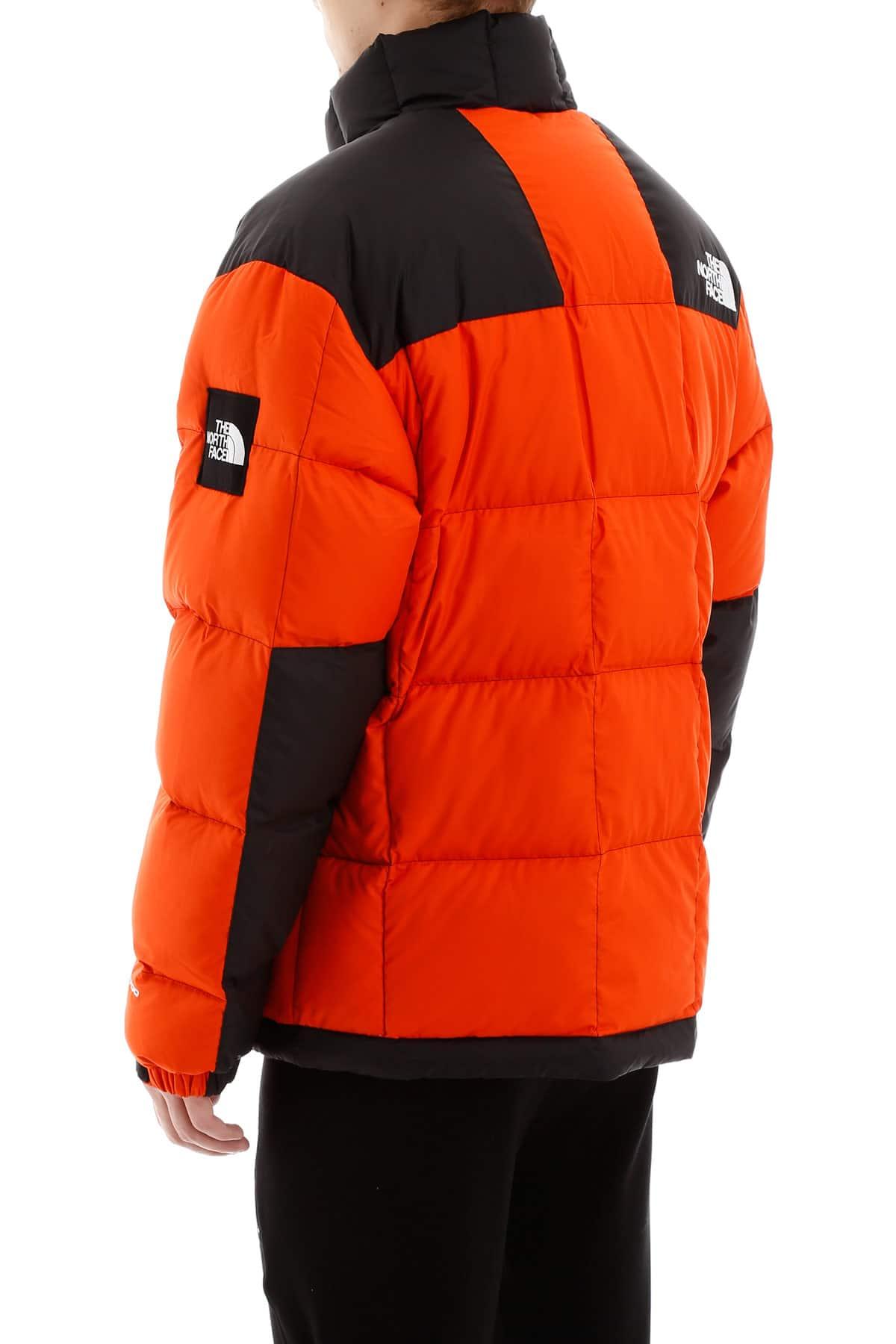 orange north face puffer jacket