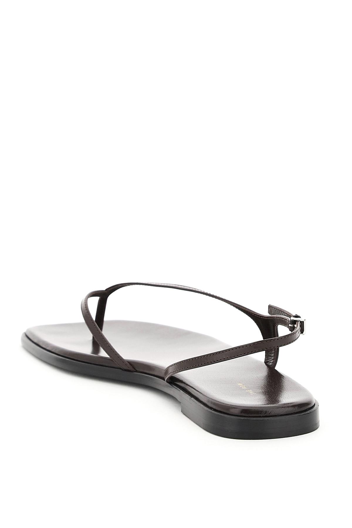 The Row Constance Flat Thong Sandals in Black | Lyst The Row Constance Flat Thong Sandals in Black | Lyst
