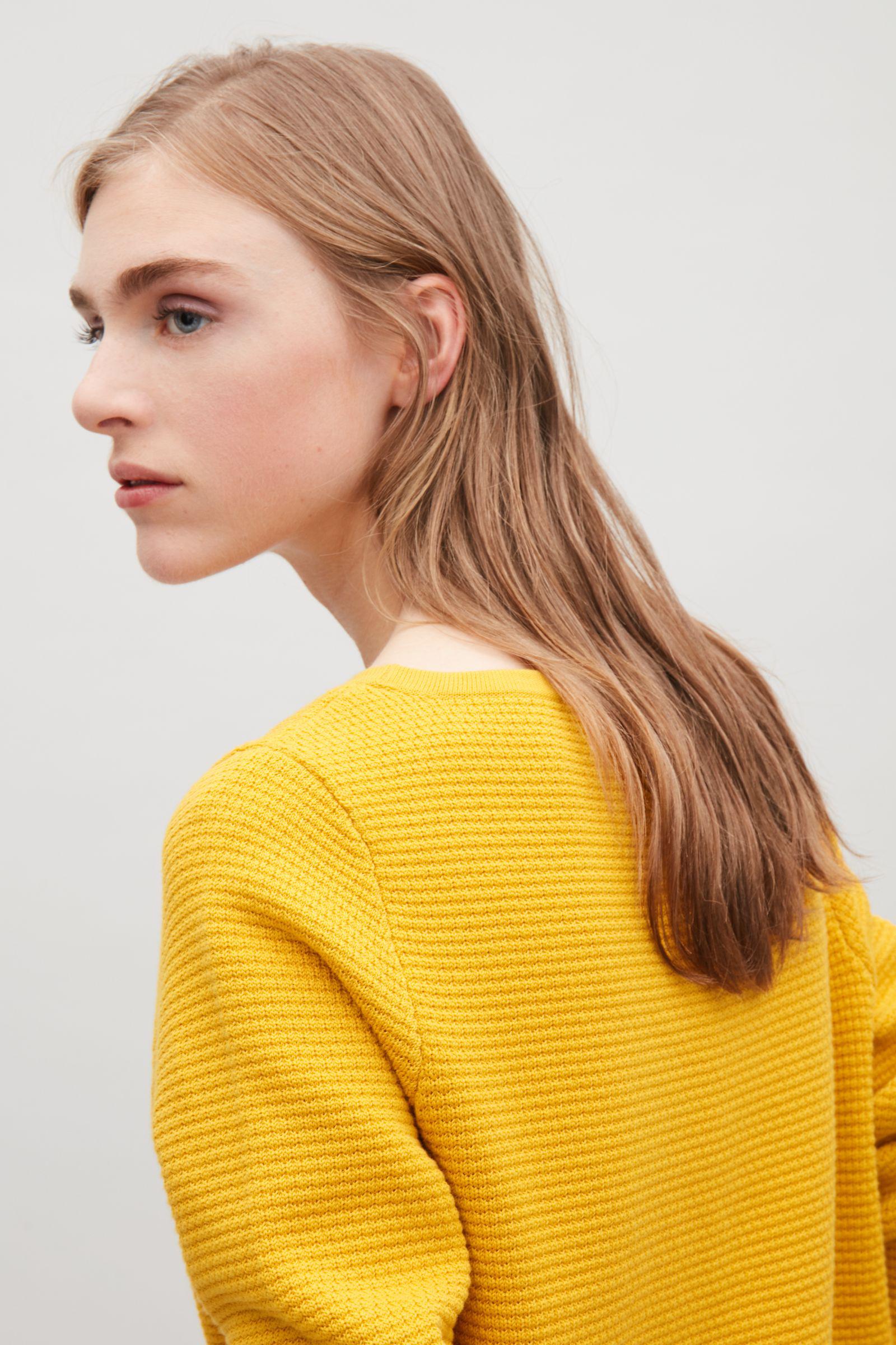 cos yellow sweater