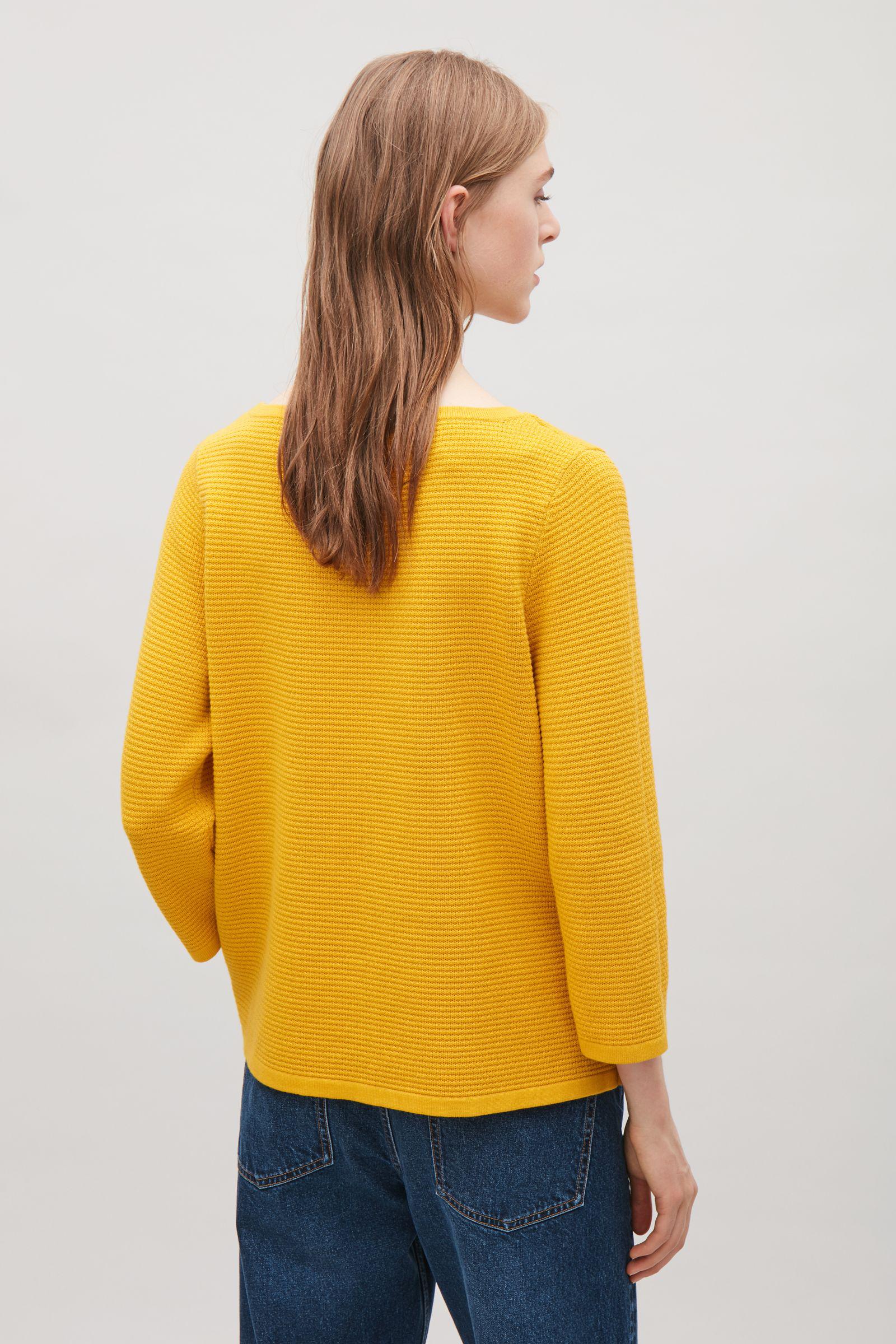cos yellow sweater
