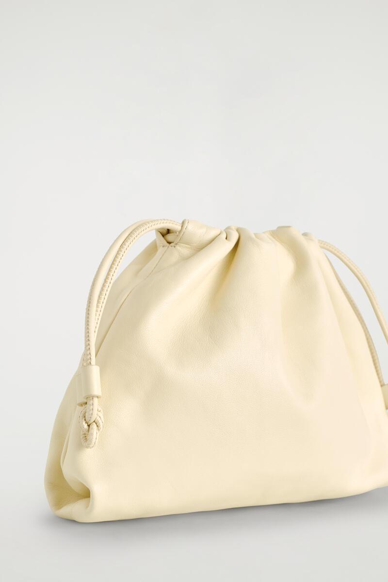 COS Mini Cavatelli Clutch Bag in Natural | Lyst