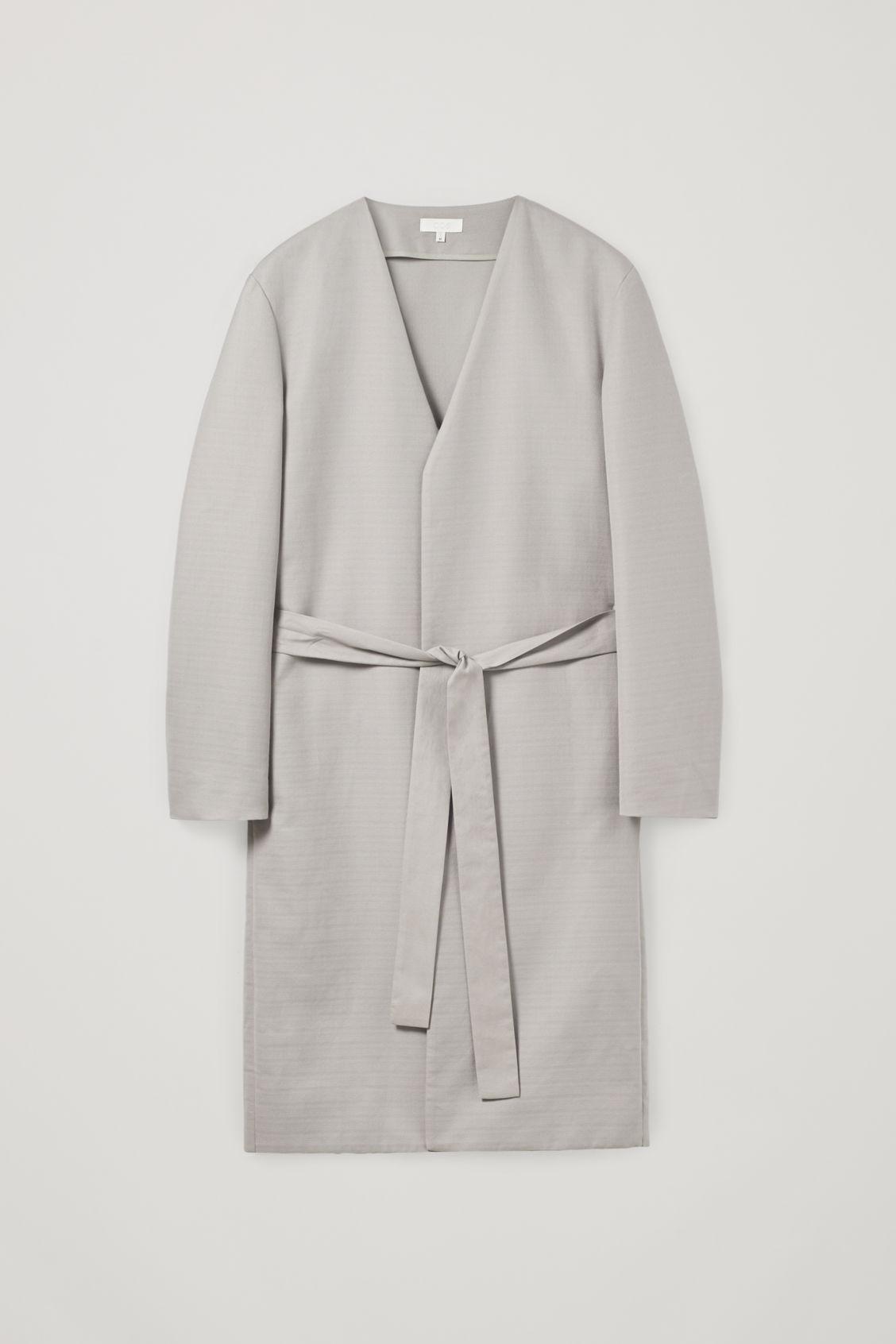 white collarless coat