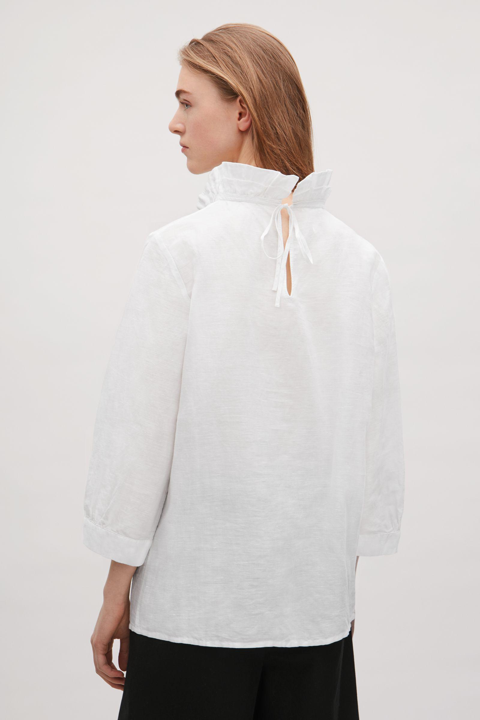 white frill neck blouse