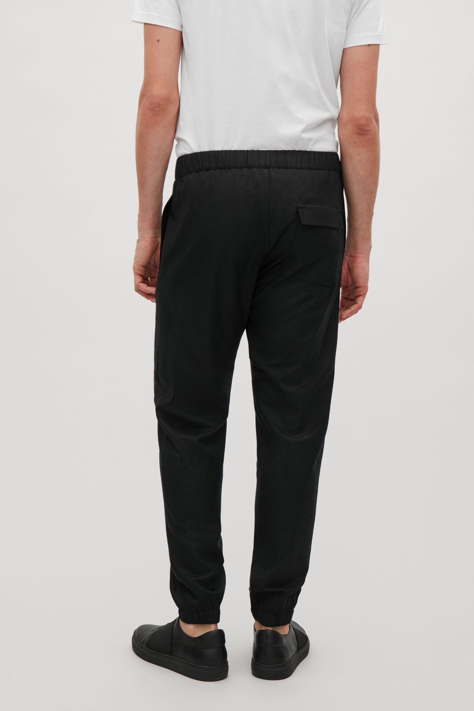 COS Elasticated Wool Trousers in Black for Men - Lyst