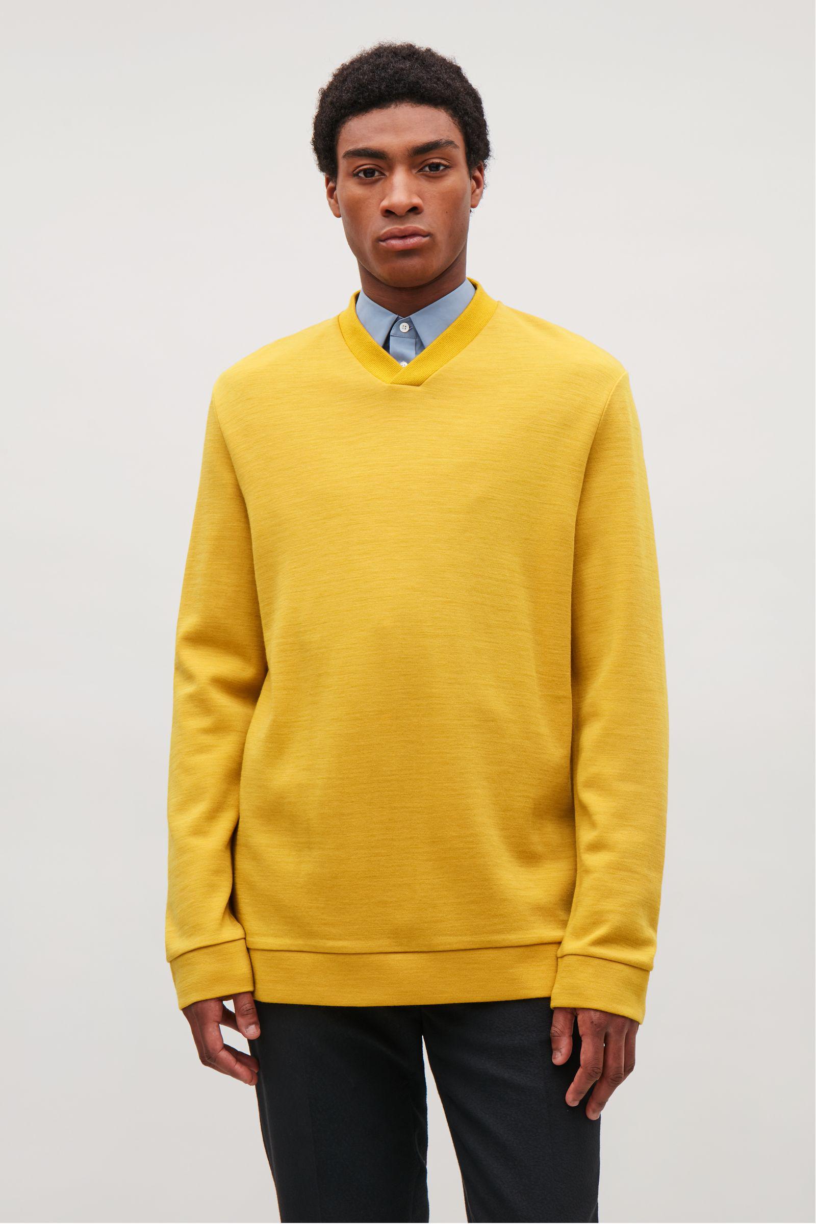 cos yellow sweater