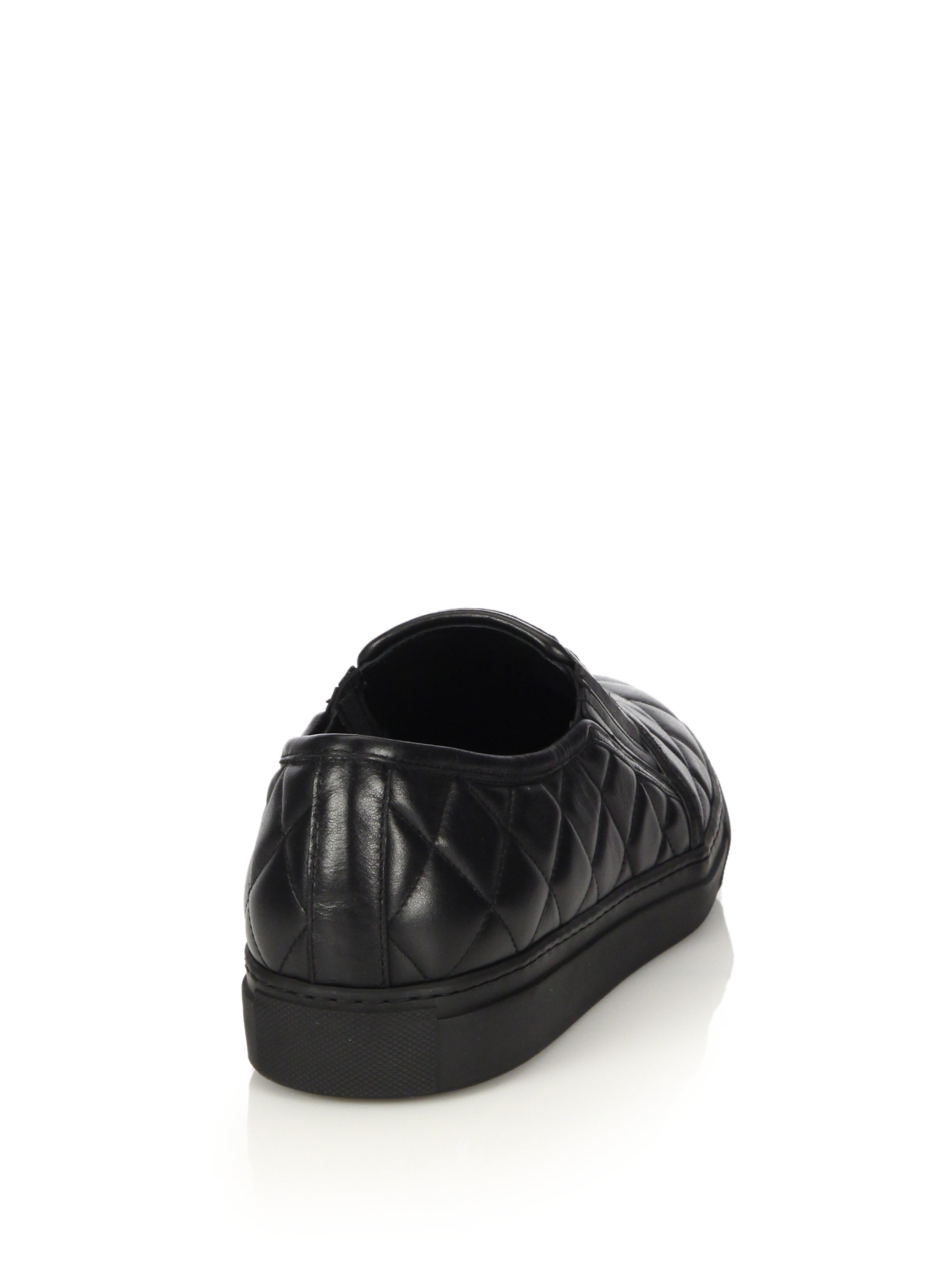 black quilted leather slip ons