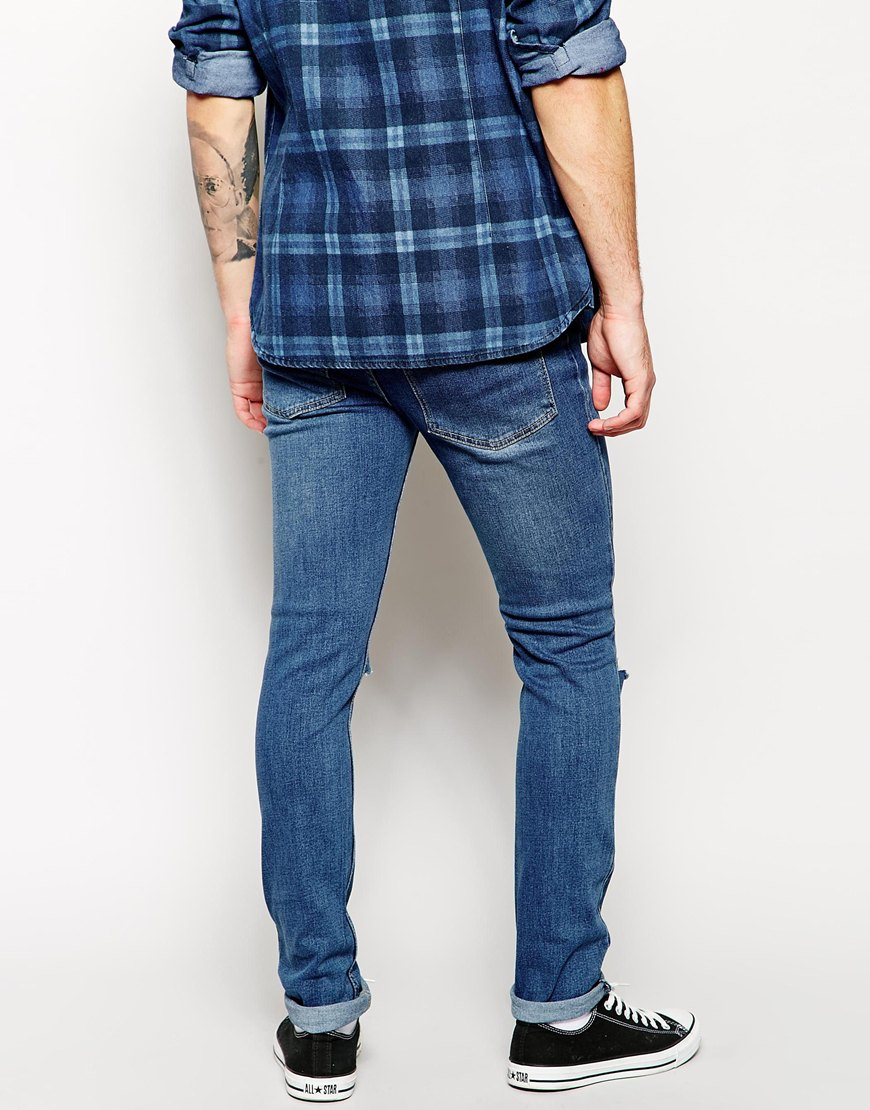 Cheap monday Exclusive Tight Skinny Jeans With Ripped Knee in Blue ...