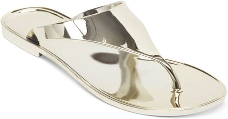Bcbgeneration Starr Flat Thong Sandals in Gold | Lyst
