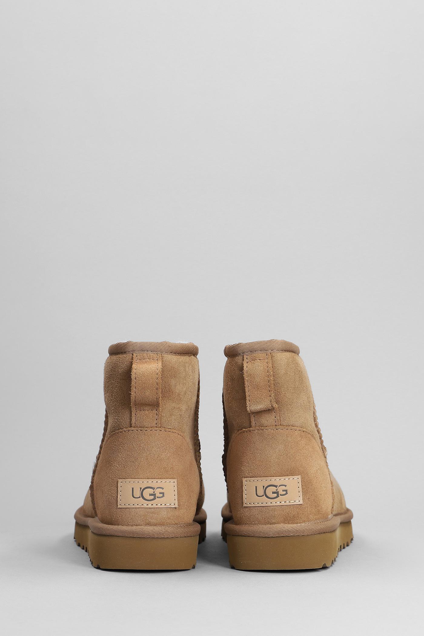 UGG Classic Mini Ii Sheepskin Boots in Brown | Lyst