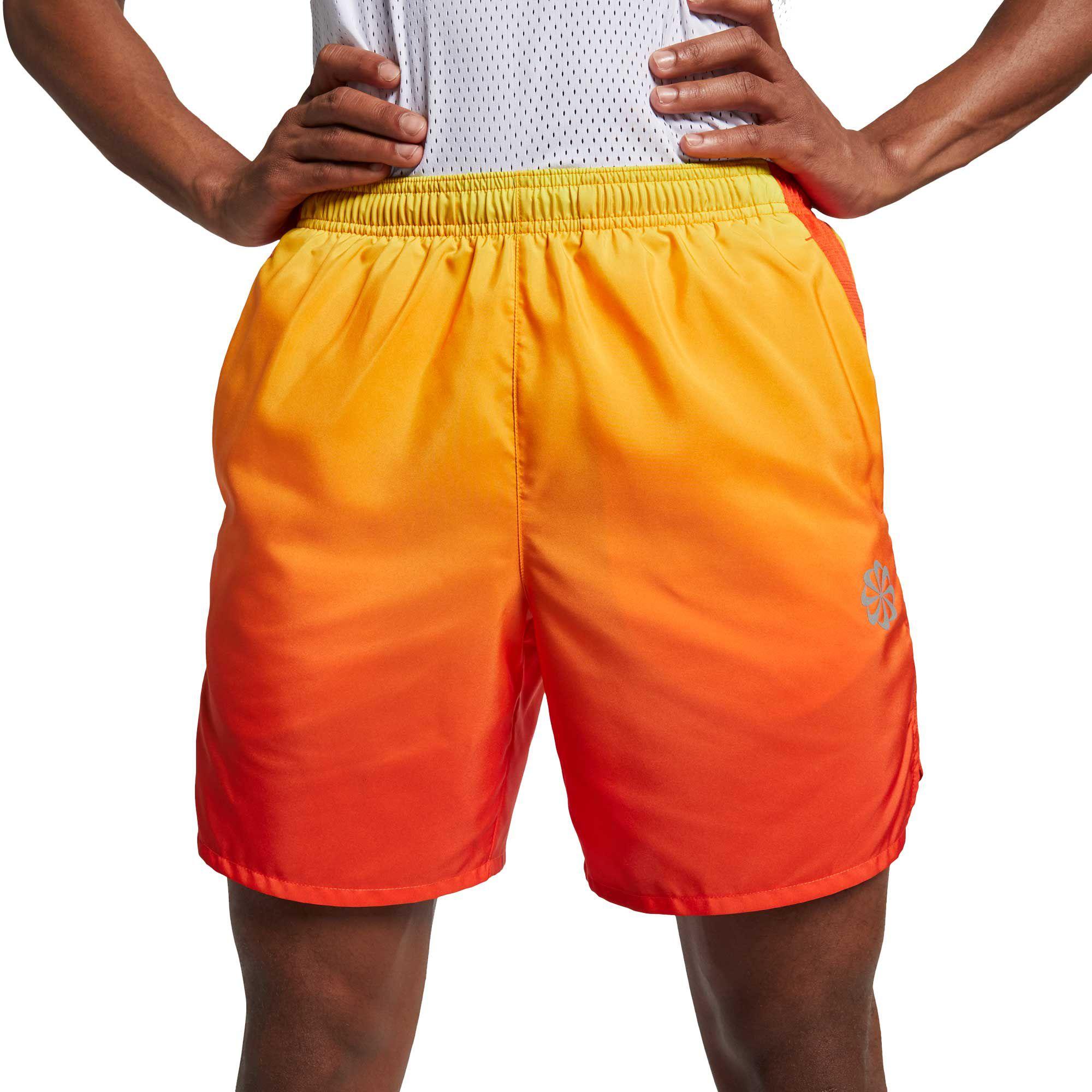 black and orange running shorts
