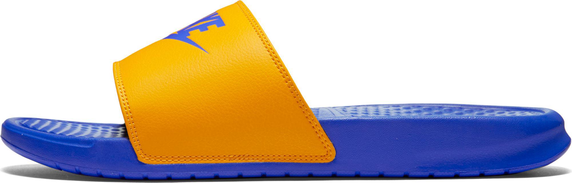 blue and yellow nike slides
