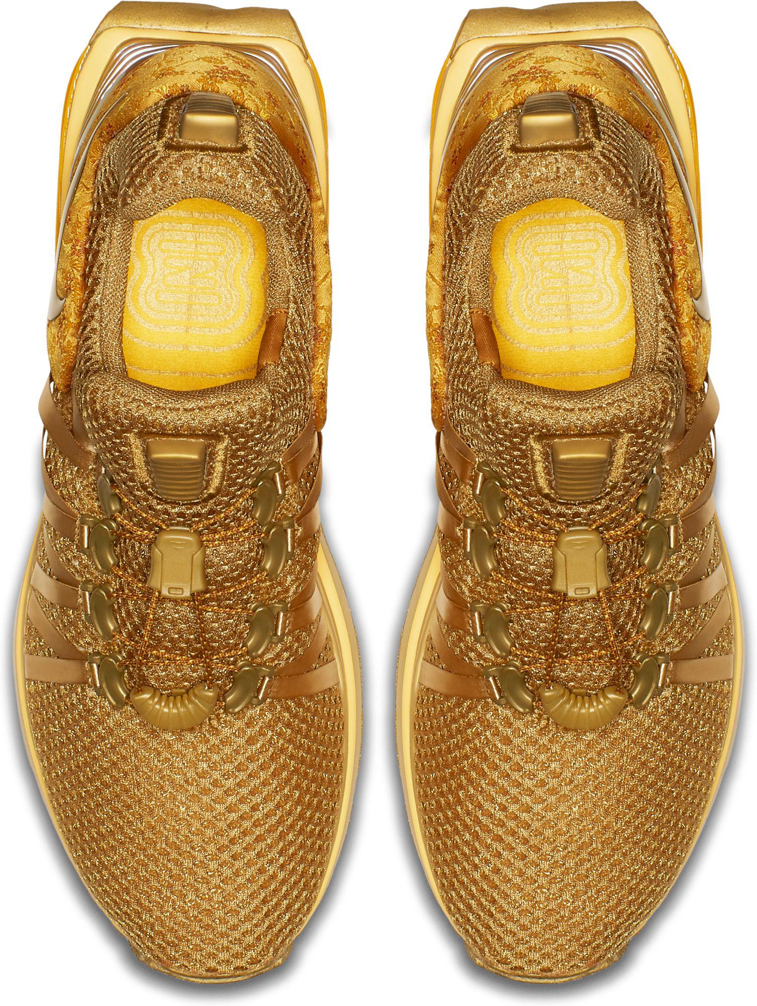 metallic gold nike shox gravity