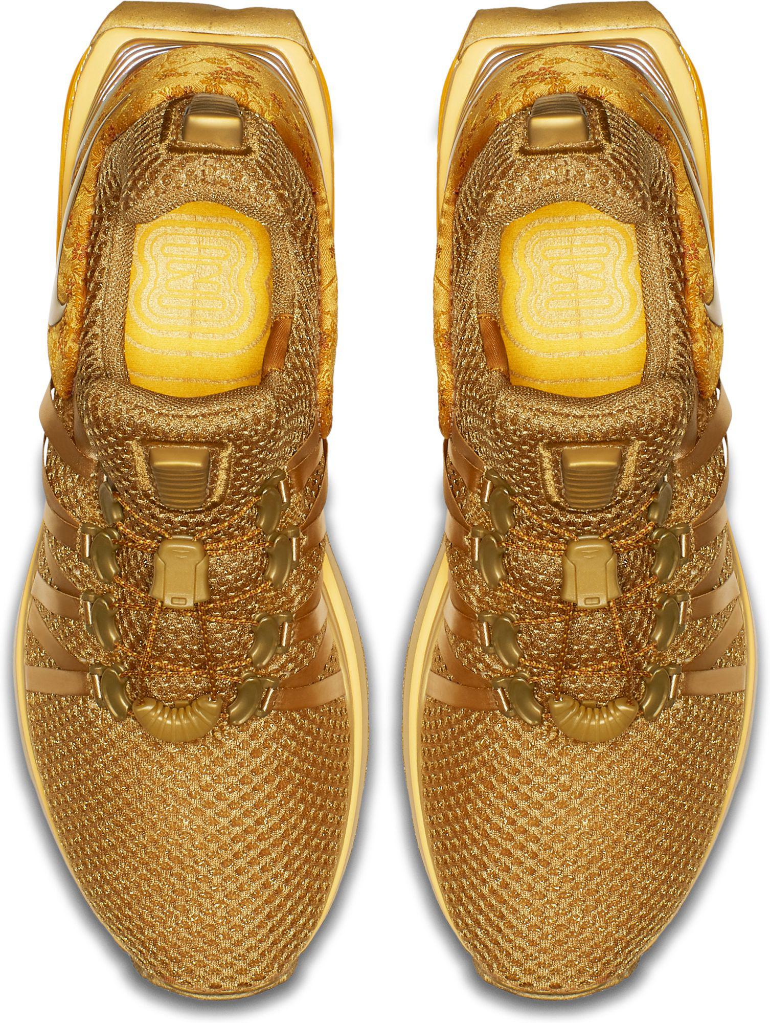 nike shox gravity women's gold