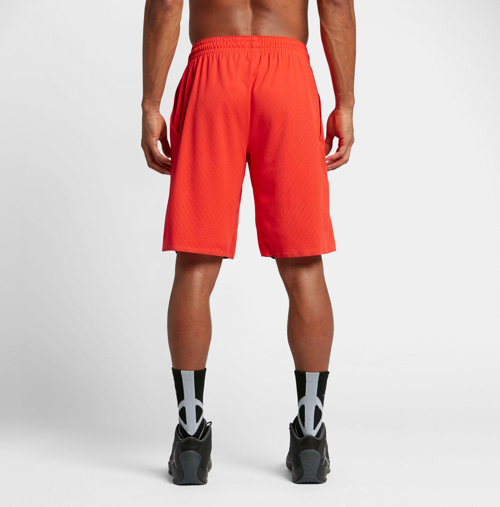 black and orange jordan shorts