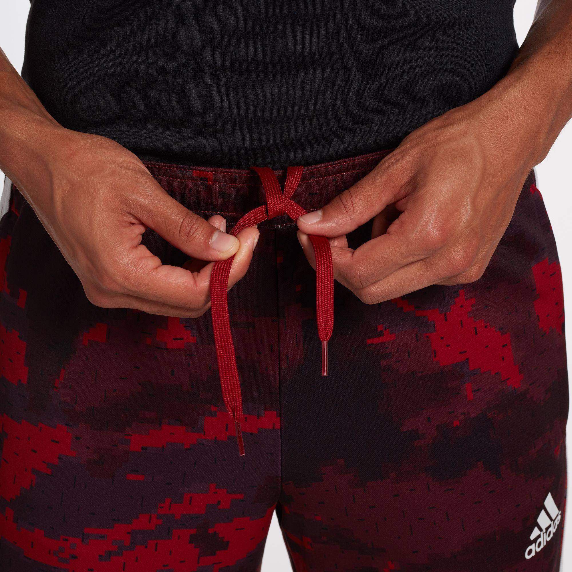 red tiro pants