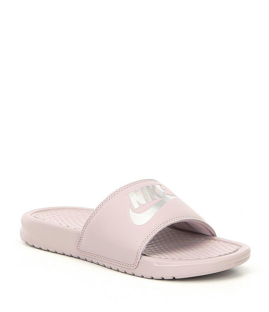 pink and silver nike slides