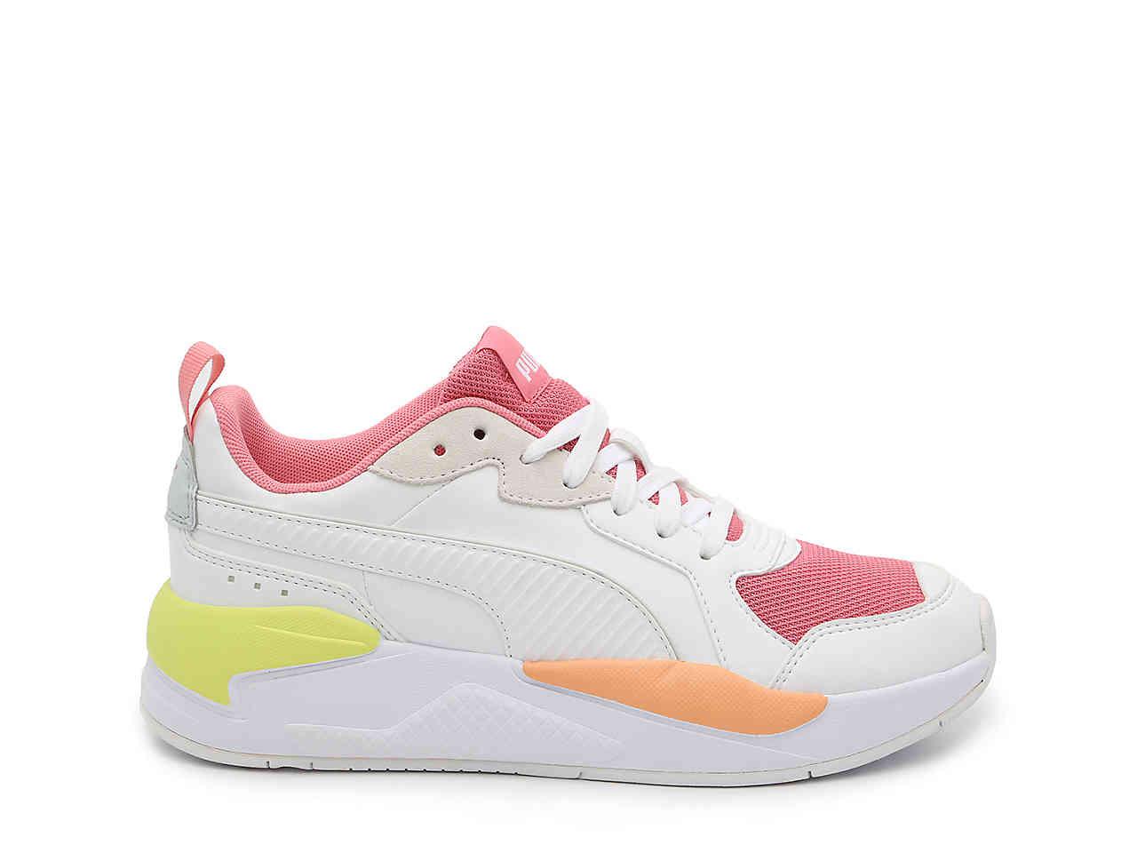 lime green and pink pumas